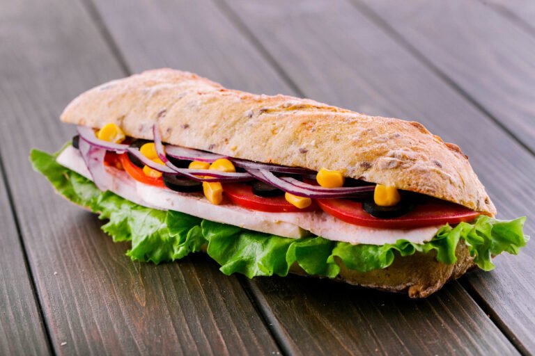 delicious sandwich with blue onion, corn and meat